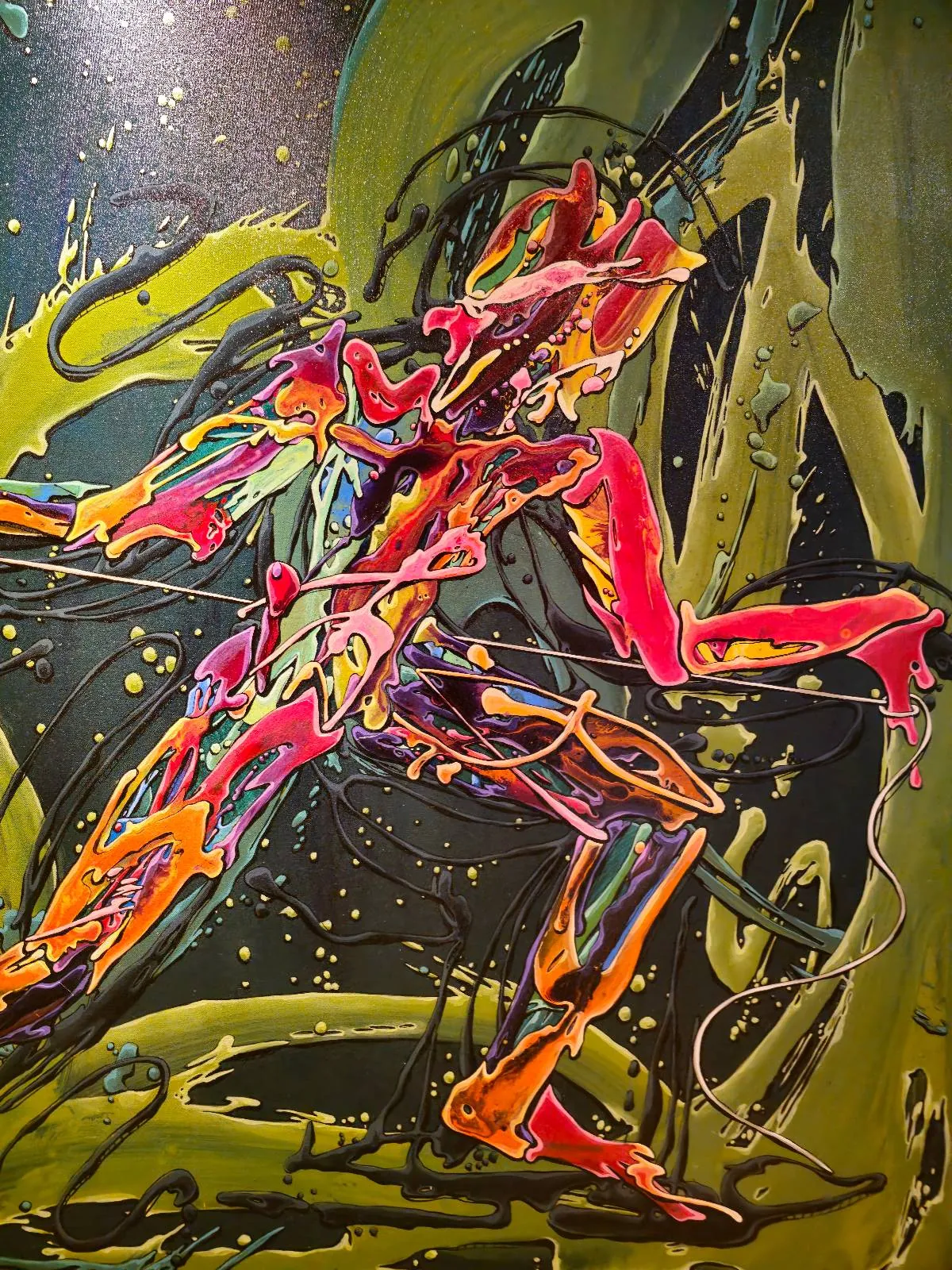 Abstract painting featuring vibrant, swirling strokes of red, yellow, orange, and purple on a green and black background, creating the impression of a dynamic, energetic figure in motion.