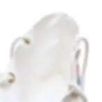 A close-up of a white bag with rope handles threaded through brass eyelets, set against a plain white background.