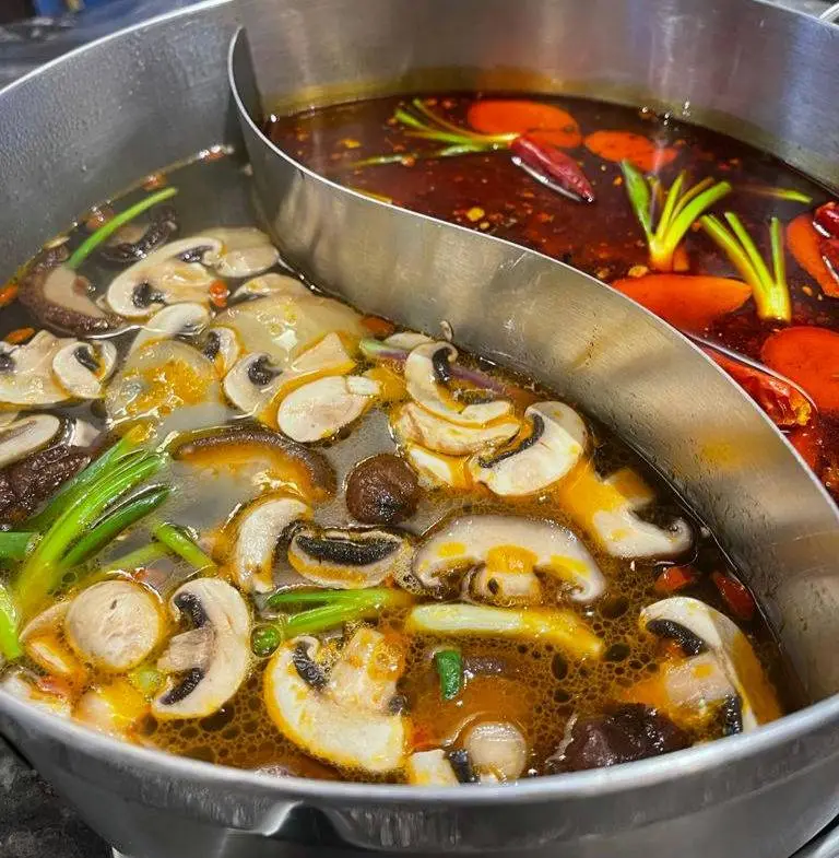 Korean Hot Pot with mushrooms, beans and peppers.