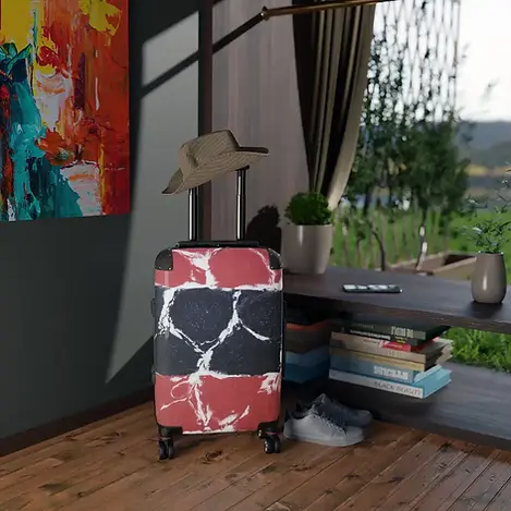 Red and black marbled stripe suitcase with a travel hat resting on its handle, displayed next to a "Travel Time" collection banner in the Closer Lives store.