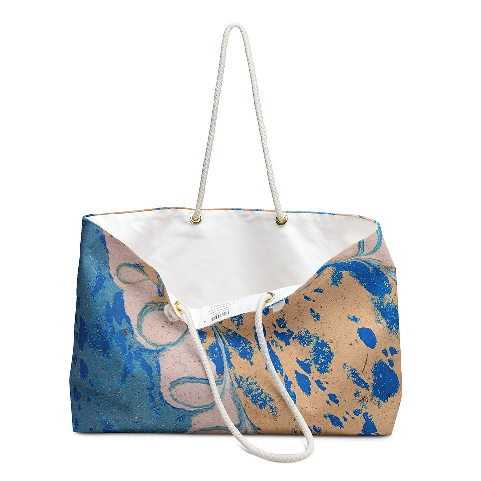This Peacock Feather Weekend Bag, inspired by Mexican culture, showcases a striking blue and tan marbled pattern.