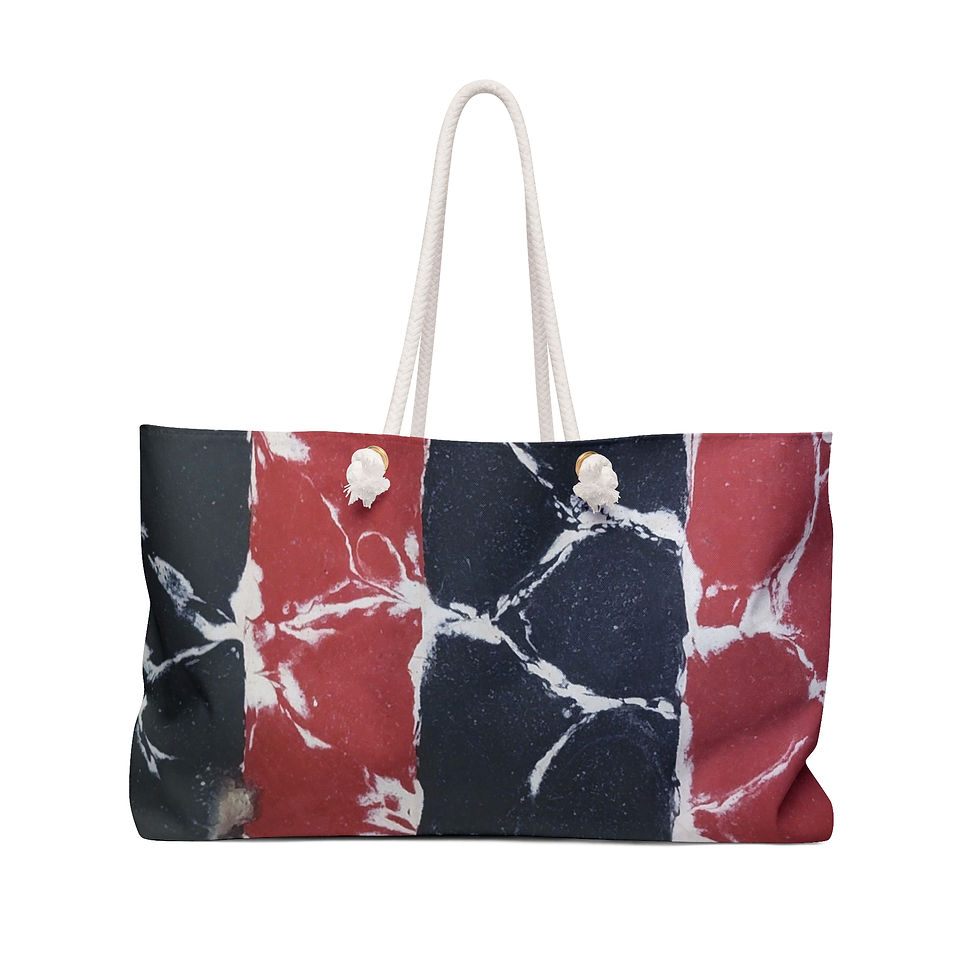 A large tote bag with a marble pattern featuring vertical stripes in red, black, and white, perfect for travel gear.