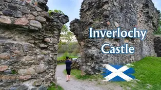 Person photographs Inverlochy Castle ruins through a stone archway; grassy path, river, and Scottish flag graphic with text visible.