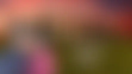 Couple smiling in front of Stonehenge at sunset. Text reads "STONEHENGE" and "Journey into Ancient Mysteries" on right. Warm hues evoke wonder.