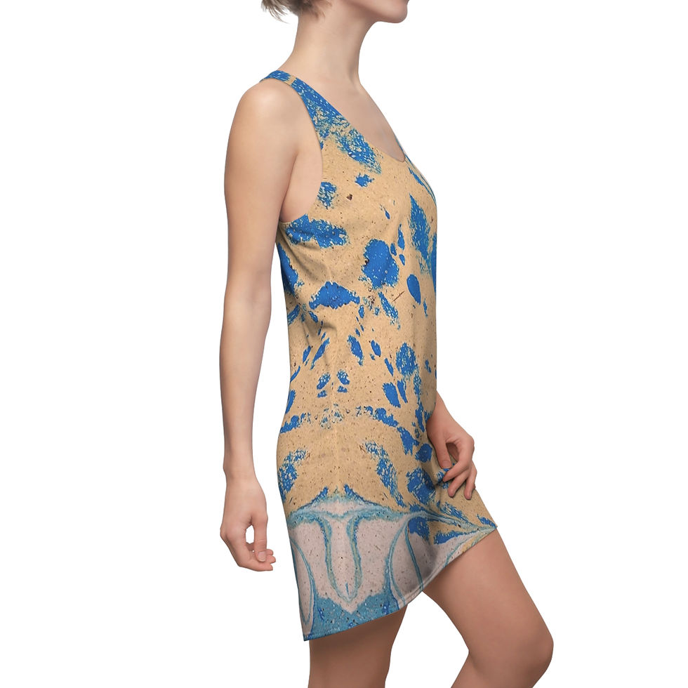 Person wearing a sleeveless racerback dress with a blue and beige abstract pattern, reminiscent of a peacock feather.