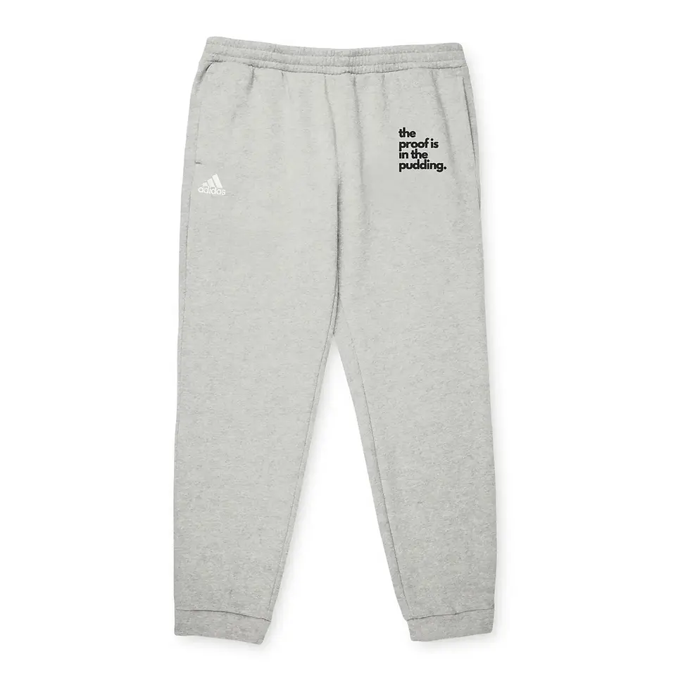 Thumbnail: Grey heather “The Proof is in the Pudding” Adidas fleece joggers, front view.