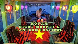 A boat with colorful lanterns and life vests displayed, promoting the Hoi An Night Market & Lantern Festival. A person stands in the background, preparing something on the vessel.