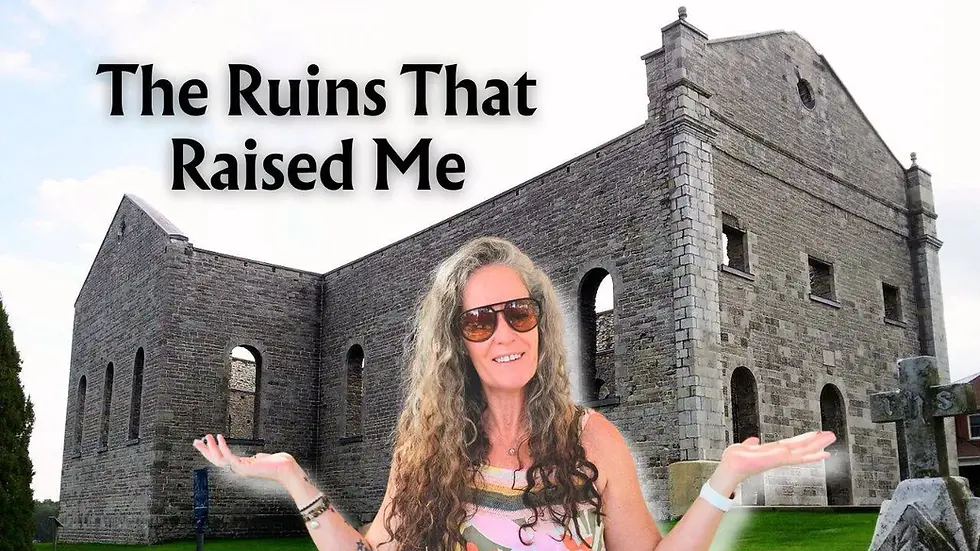 Woman smiling in front of a stone ruin with arched windows, wearing sunglasses, arms outstretched. Text: "The Ruins That Raised Me."