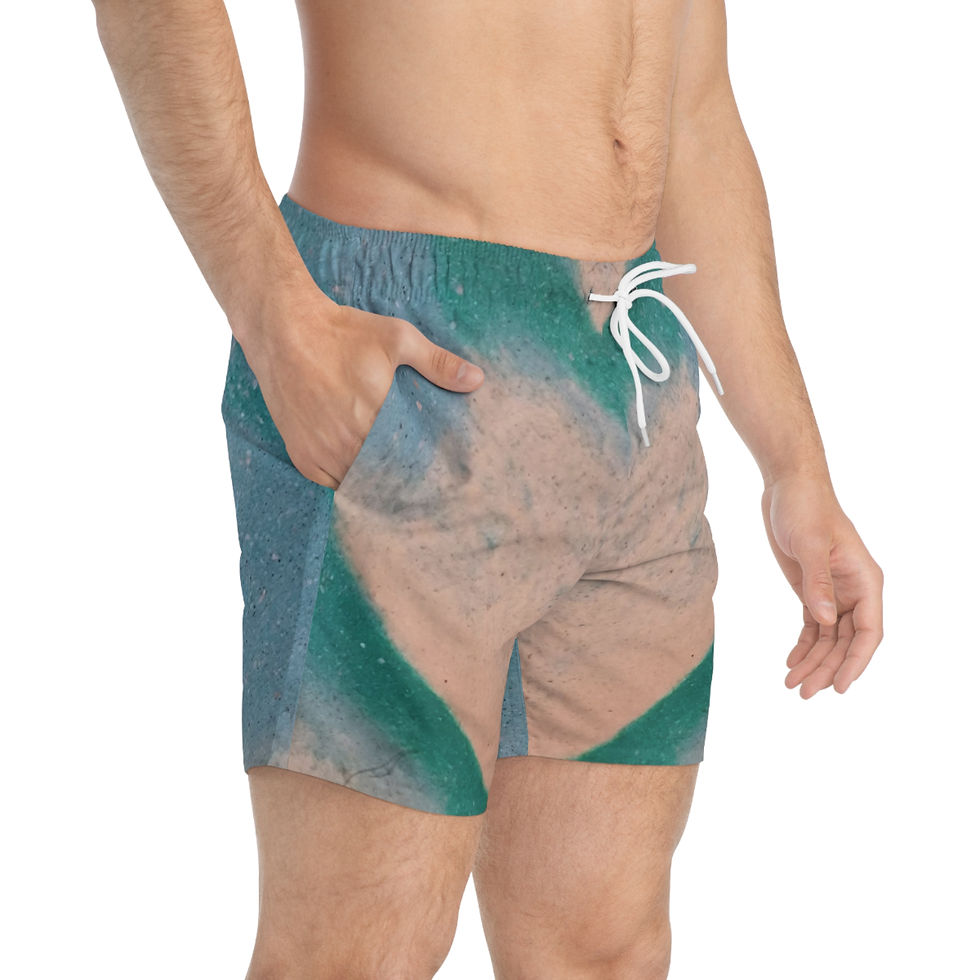 A person wearing swim trunks featuring a fast-drying teal and cream marble pattern stands with one hand in the pocket.