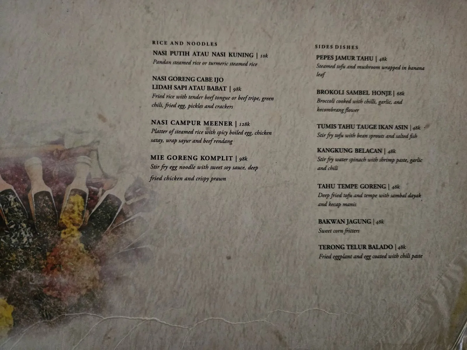 A restaurant menu featuring a list of sparkling wines and champagnes on a textured background, with images of champagne bottles and glasses filled with drinks on the left side.
