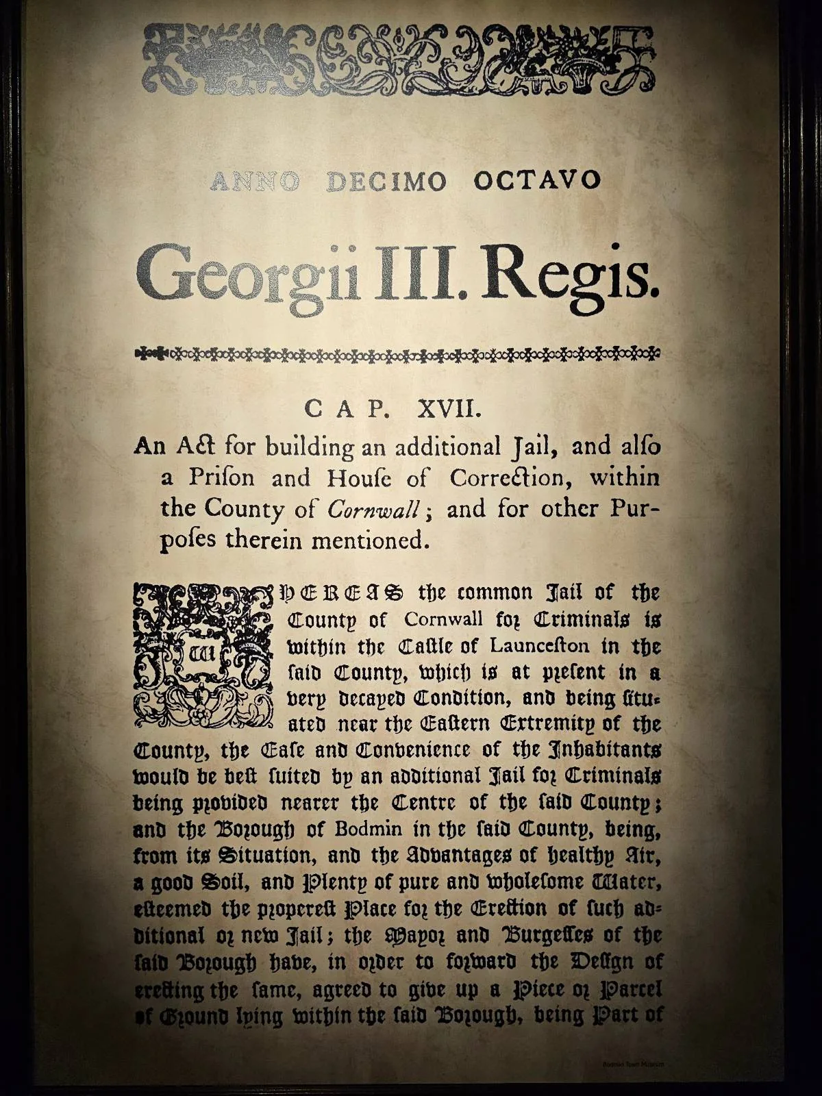 A close-up of an old document titled "Georgii III Regis" with text detailing a specific act passed under King George III's reign.