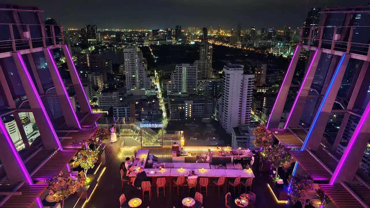 Night view across Bangkok’s illuminated skyline from Spectrum Lounge & Bar.