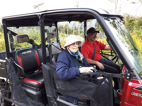 90 year old Under the Stump tour participant in the accessible ATV driven by Perry Reid