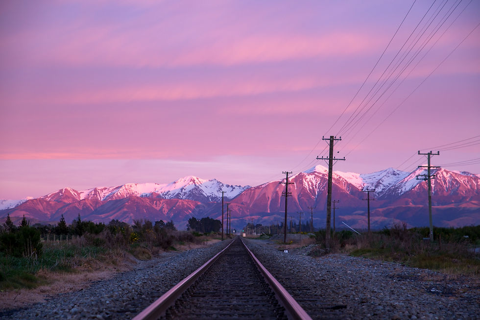 A pink sunrise over the snowy mountains