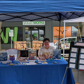 Tamara tabling at Grand Forks Pride event.