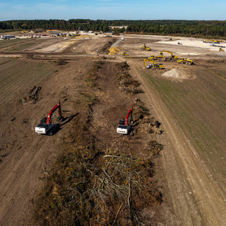 Drone aerial of Phase I site development showing land clearing and early groundwork for a large construction project..