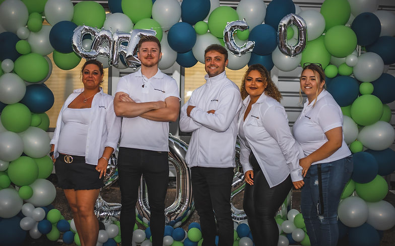 Essex Event Planners team posing together, dressed professionally and smiling