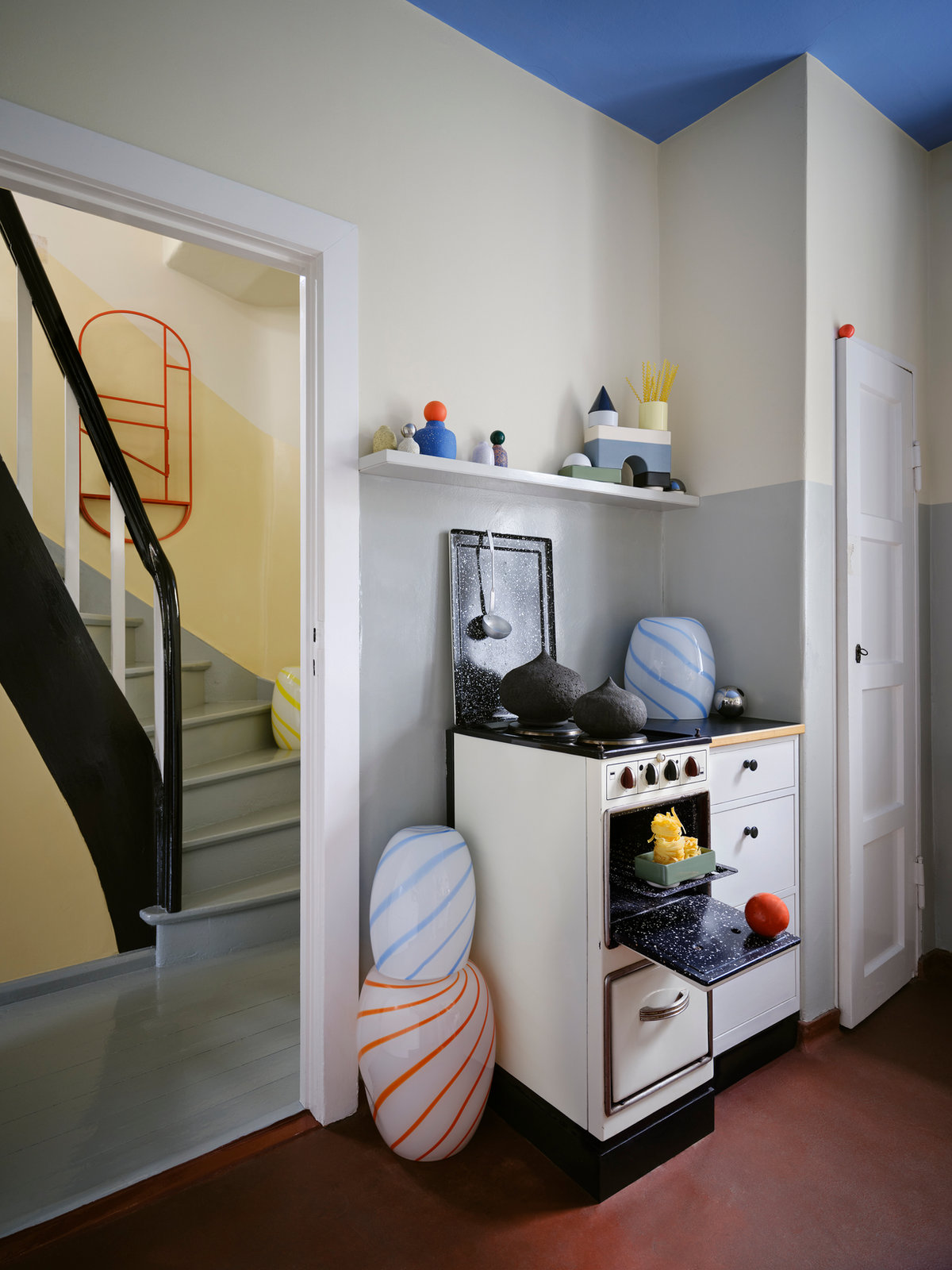 View through the hallway into the kitchen at Tautes Heim with STUDIO BERG objects