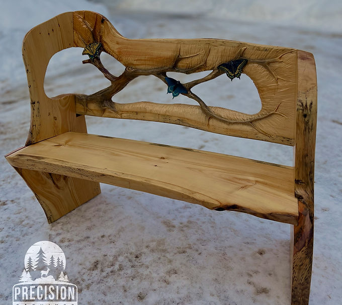 chainsaw carved bench with butterflies