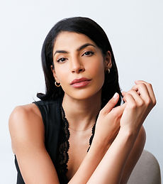 Nailah- A commercial model and actress with brown curly hair and brown eyes. Represented by Roc talent agency.