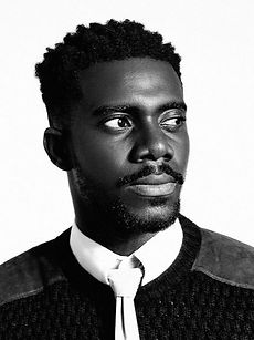 Dafy - black and white headshot of male model with a fade haircut, goatee, and wearing a shirt, represented by ROC Talent Agency UK