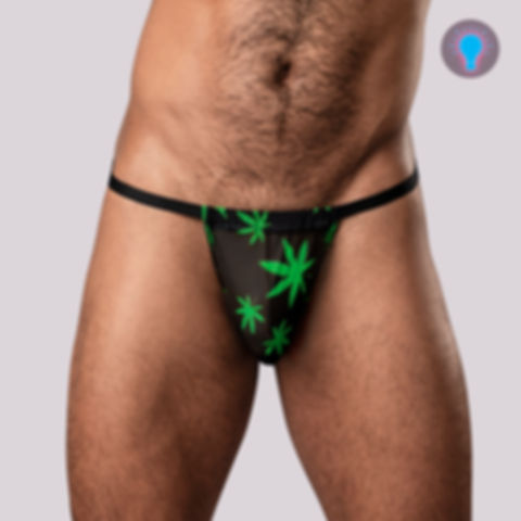 Alluring and captivating this blacklight reactive innovative pot leaf print men's G-string is shown side view.