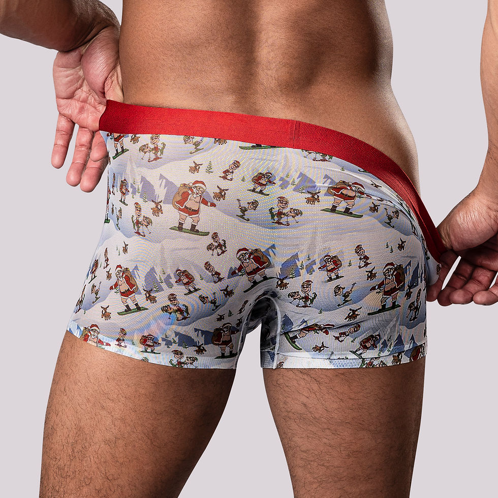 Thumbnail: Back view of male model in sheer boxer brief short with festive Santa print and red band.