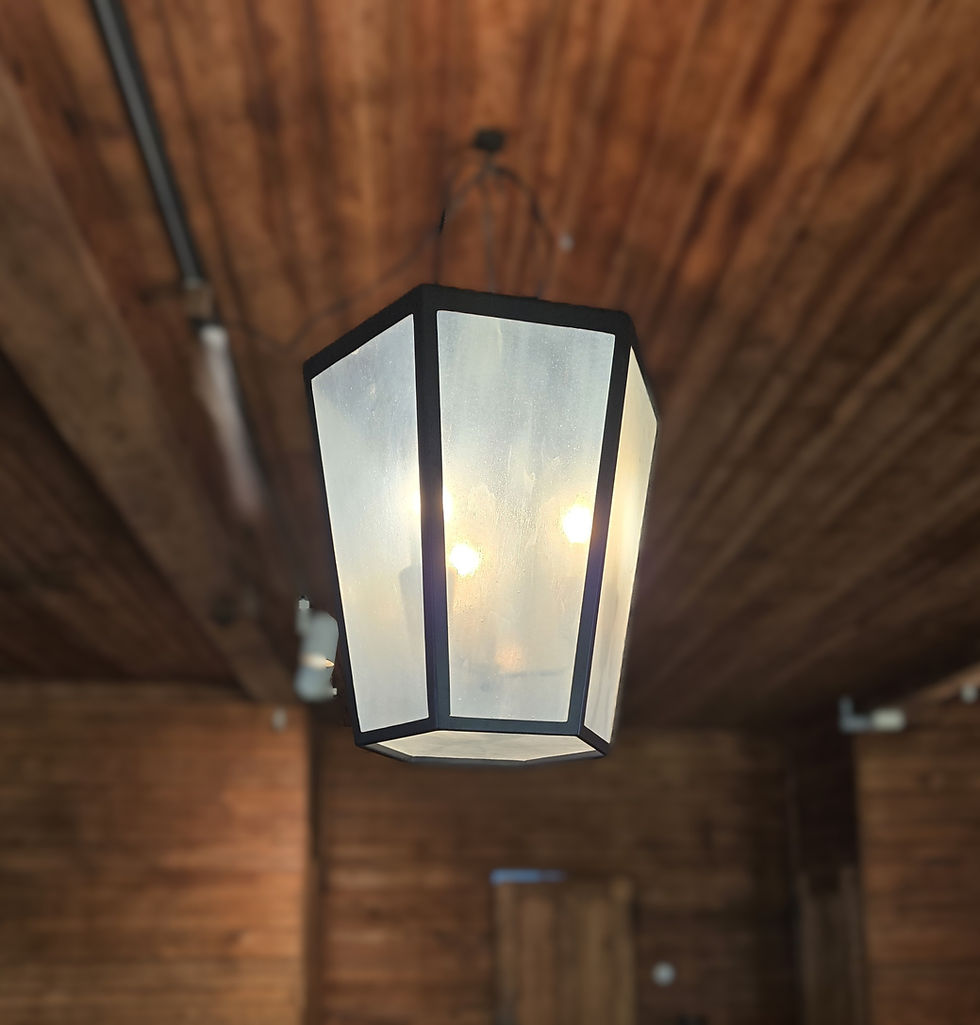 Large six-sided hanging light fixture with cloudy white glass