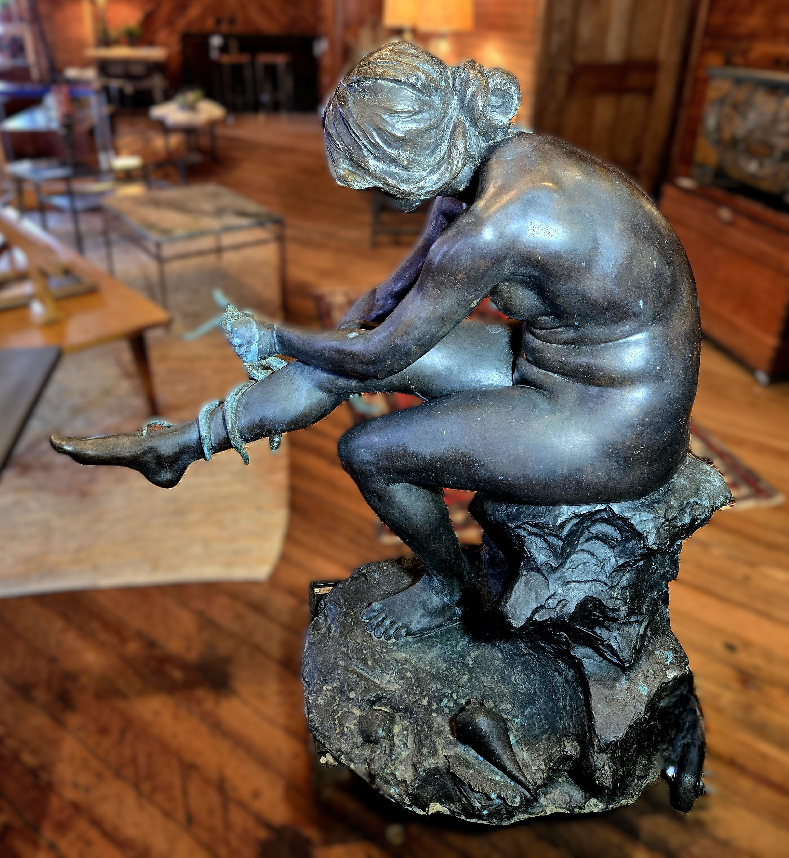 Monumental bronze fountain sculpture of seated nude with octopus, signed Gabbrielli