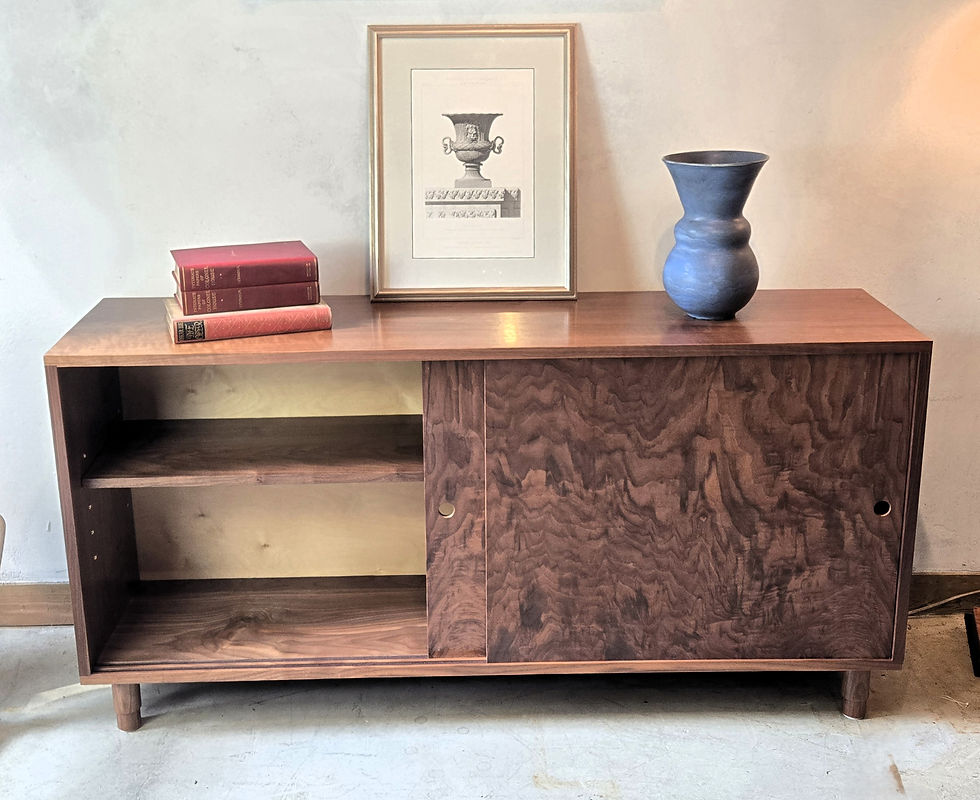 Thumbnail: Walnut console table with sliding door, books, vase