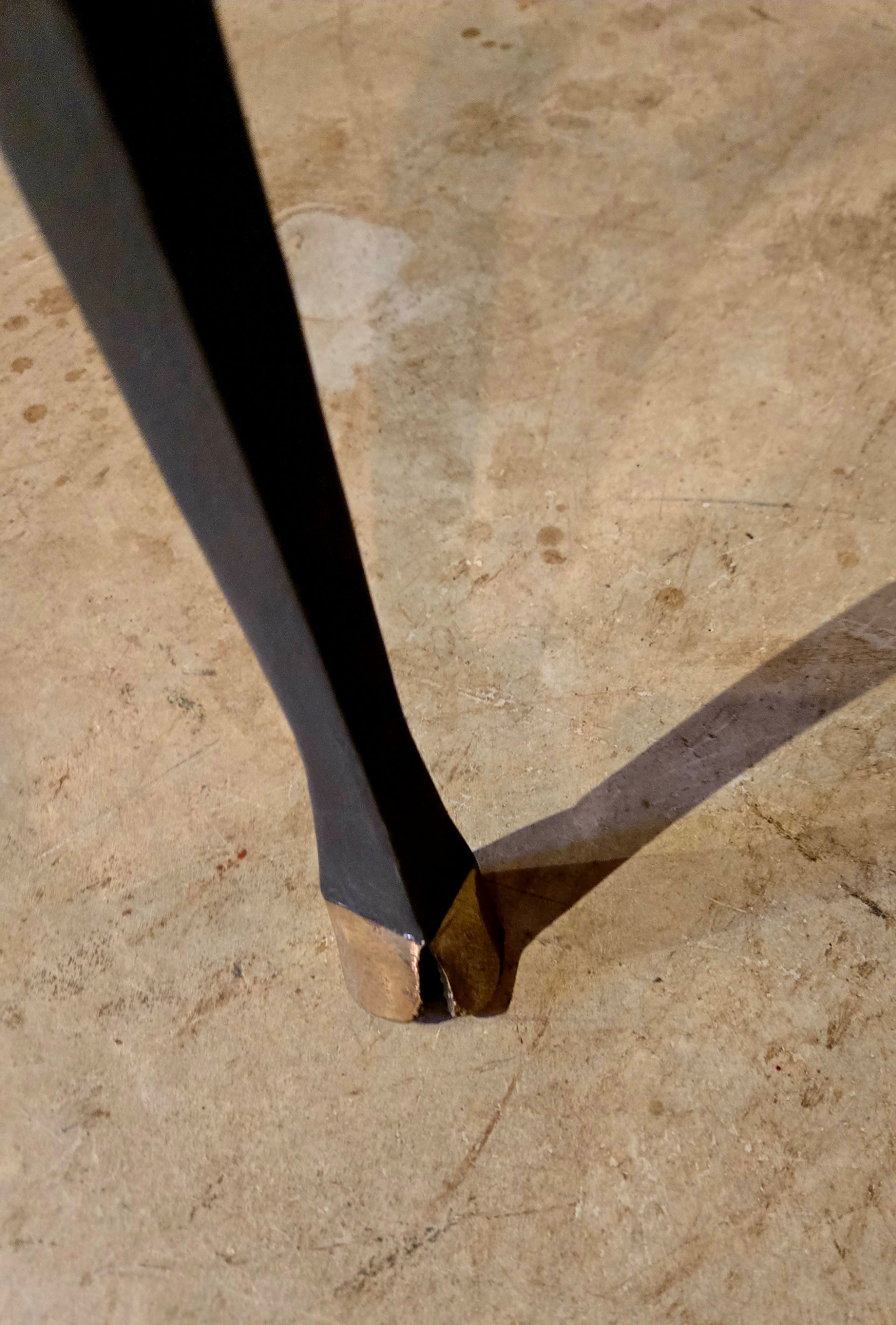 Detail of deer foot style furniture leg with bronze deer-hoof base.