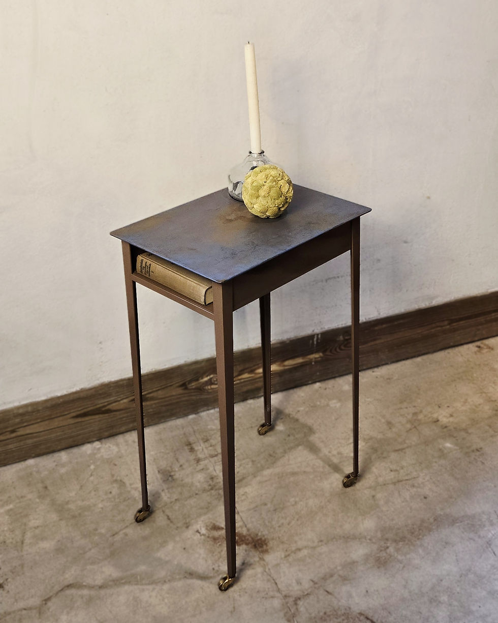 Rustic metal side table with book