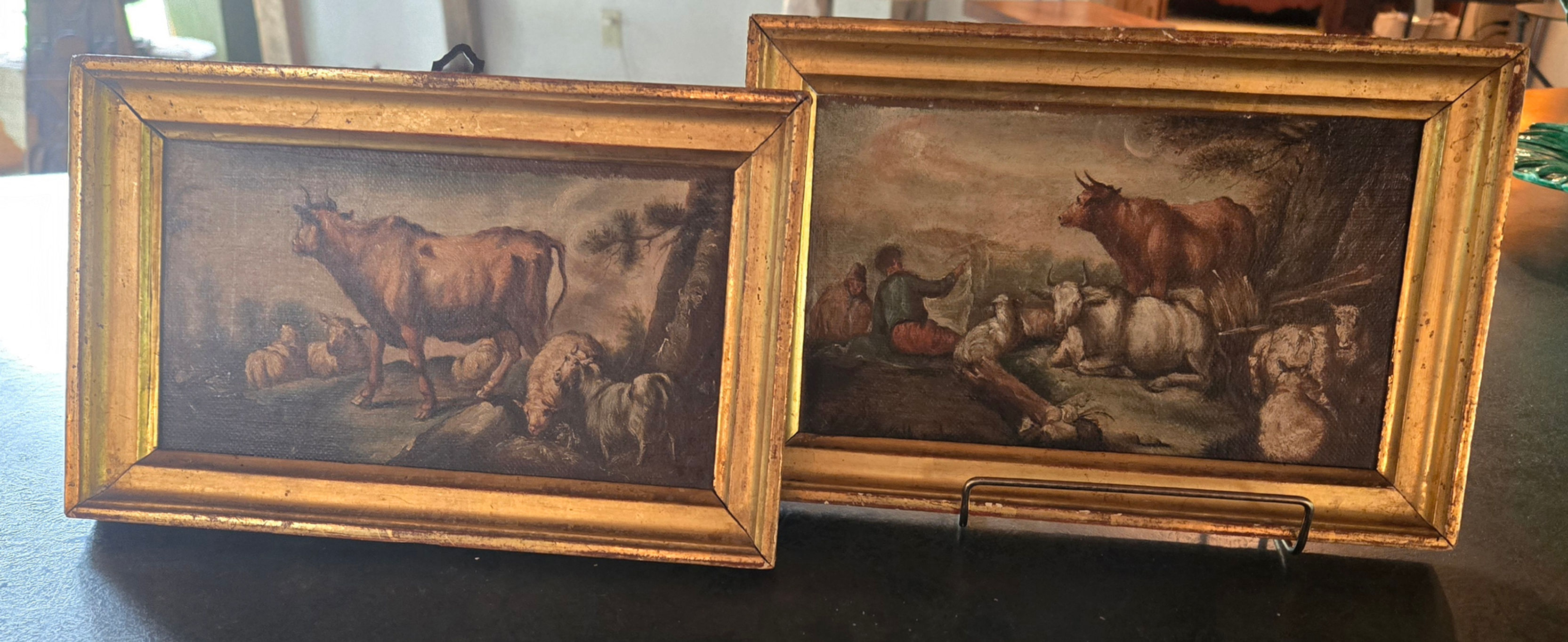 Small 19th‑century pastoral scenes showing cattle, sheep, and a lone figure in gilt frames.