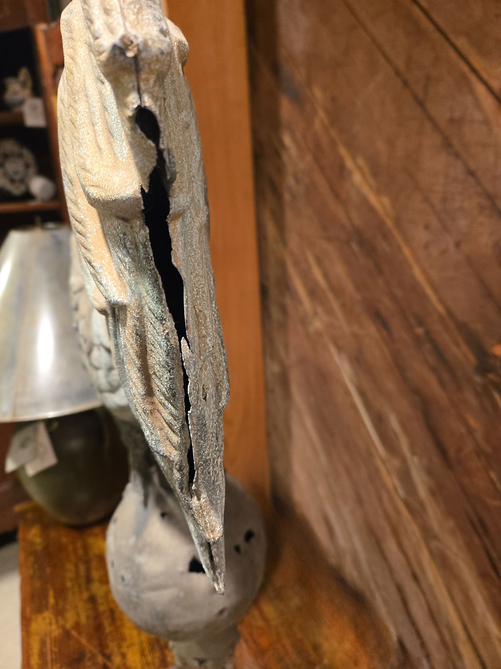 Thumbnail: Close up of cast zinc tail on 19th-century cast zinc rooster weathervane.