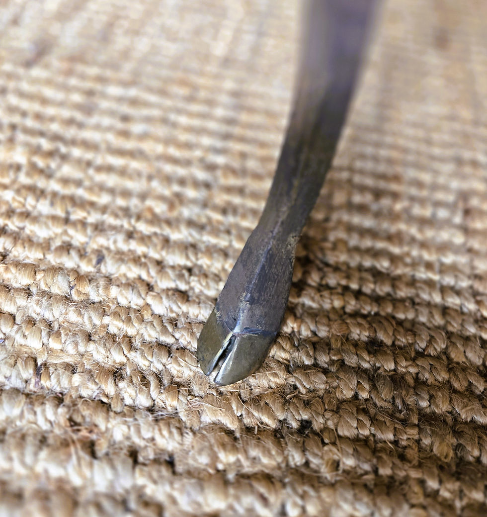 Thumbnail: Close-up of a curved metal hoof, cast bronze deer-foot.