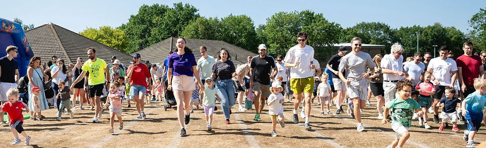 Parents and toddlers running together at the Baby Umbrella Mini Marathon 2026