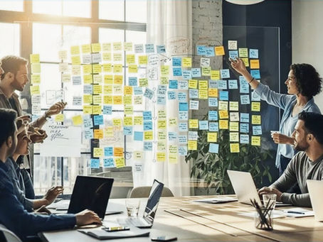 A team analysing a wall of sticky notes representing a company's growing complexity.