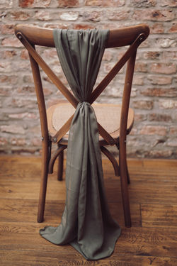 Olive green chiffon chair drape