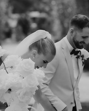 Lush bouquet of white roses tied with silk ribbon