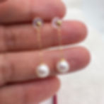 dangle pearl earrings 1-inch white on hand