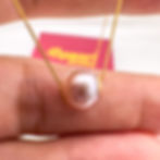 perforated pearl pendant white on hand