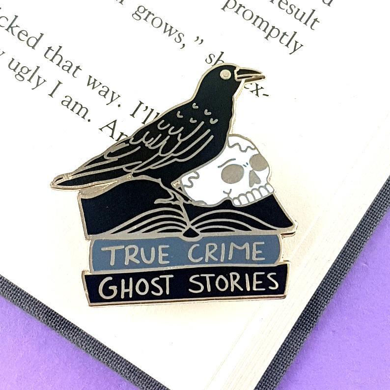 The black raven reader lapel pin