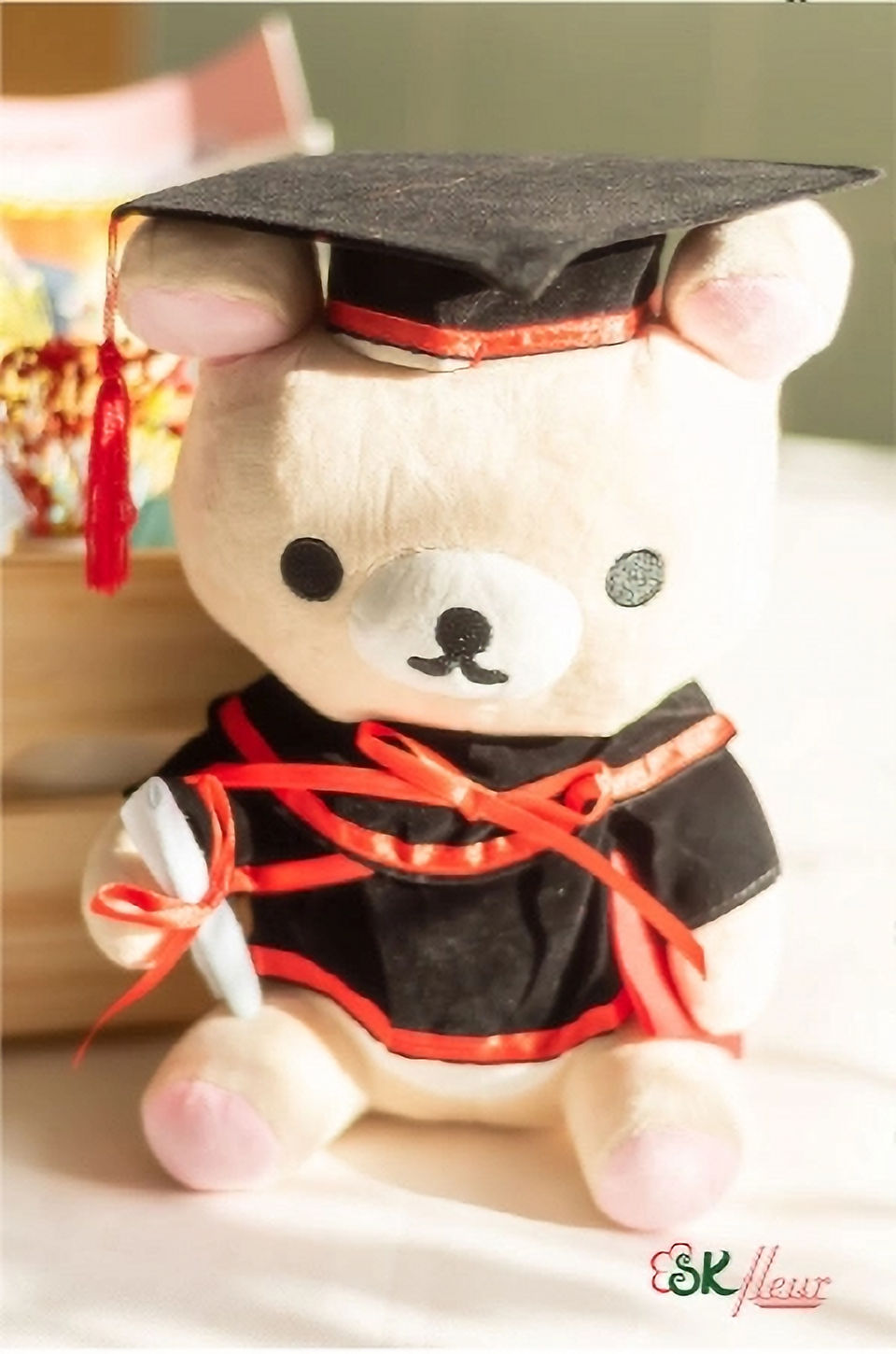 SKfleur Rilakkuma graduation plush gift in Singapore featuring a cute character teddy bear dressed in a miniature graduation gown and cap as a memorable convocation keepsake.