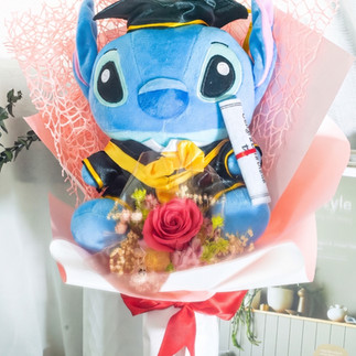 SKfleur Stitch graduation plush bouquet in Singapore featuring a popular character soft toy paired with premium everlasting preserved flowers as a unique convocation gift.