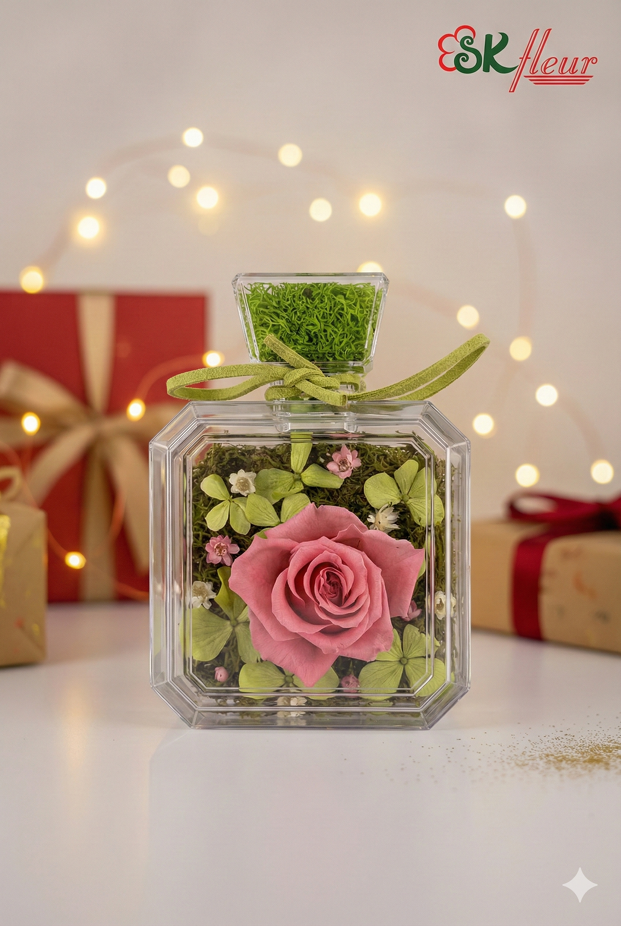 Romantic pink preserved rose in a clear square bottle by SKfleur.