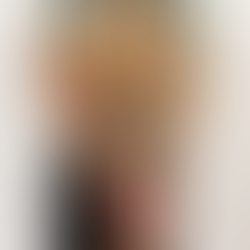 Long-lasting hand bouquet of dried flowers in warm, deep burgundy, orange, and golden autumn hues, wrapped in paper.