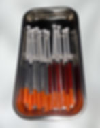 A combination of lipo B+ and lipo C in syringes on a silver tray.