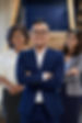 confident-asian-businessman-posing-with-crossed-arms-two-female-colleagues-standing.jpg