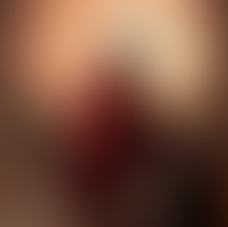 Hannah Peery at a Barbie-inspired International Women’s Day photoshoot. A young woman sitting in a brown chair with a basketball in her lap.