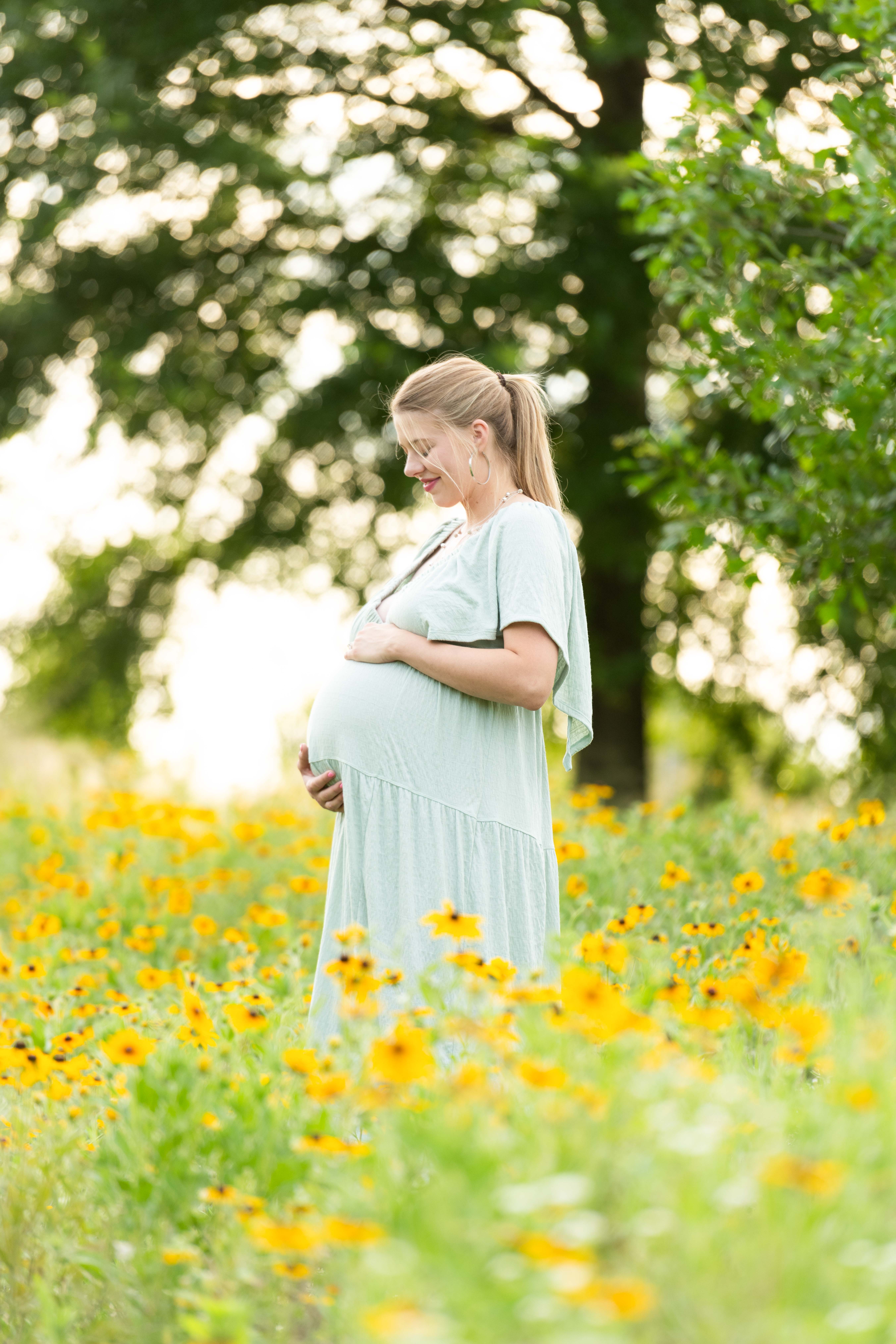 Dreamy spring flower field maternity photos. Charlotte family portrait photographer. 